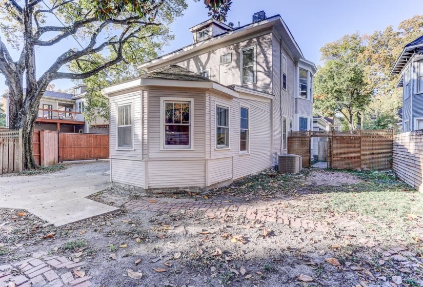 Rear view of property with a fenced backyard