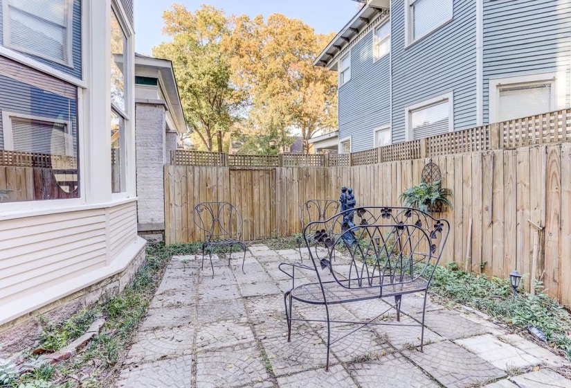 Fenced backyard with a patio area