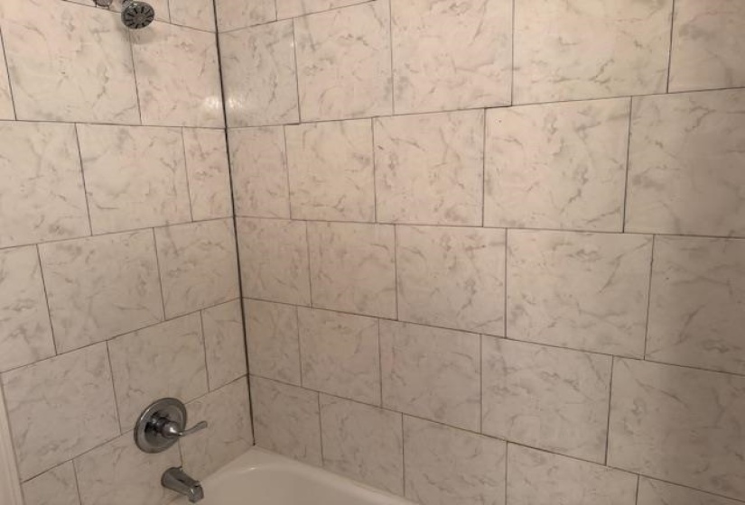 Details featuring bathtub / shower combination