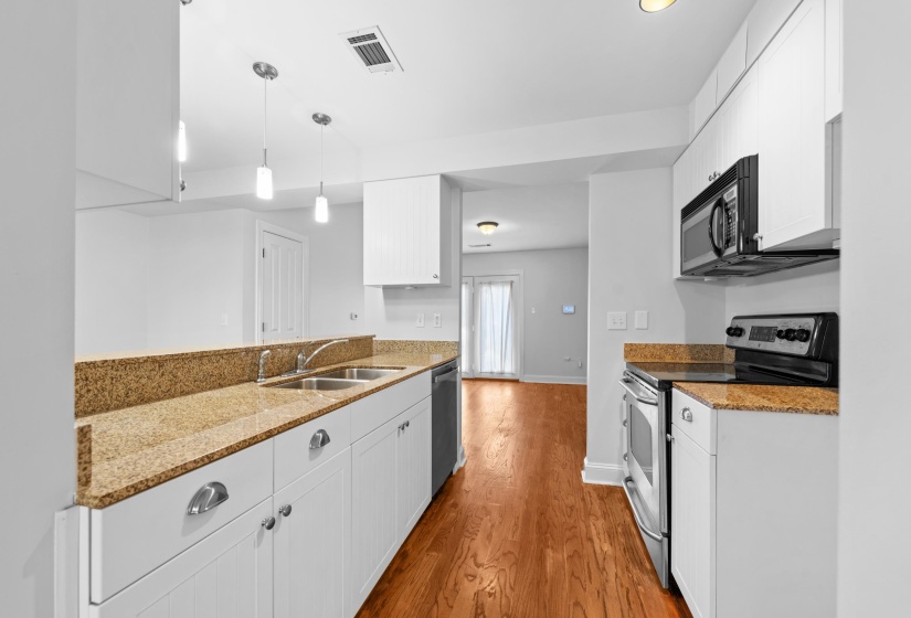 Fresh, modern upgrades and smart design make this kitchen a central gathering spot, connecting effortlessly to both living areas.