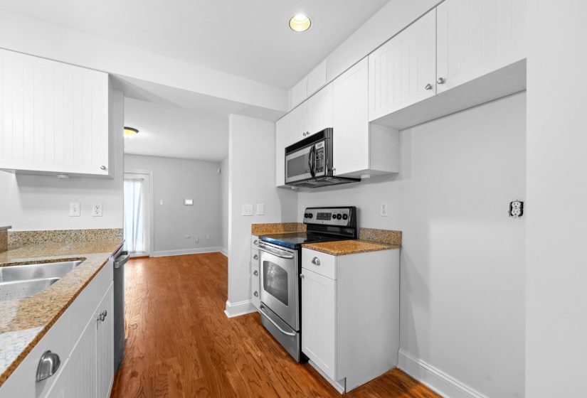 Crisp finishes, upgraded fixtures, stainless steel appliances, and an open flow highlight this renovated kitchen, offering both charm and everyday practicality.