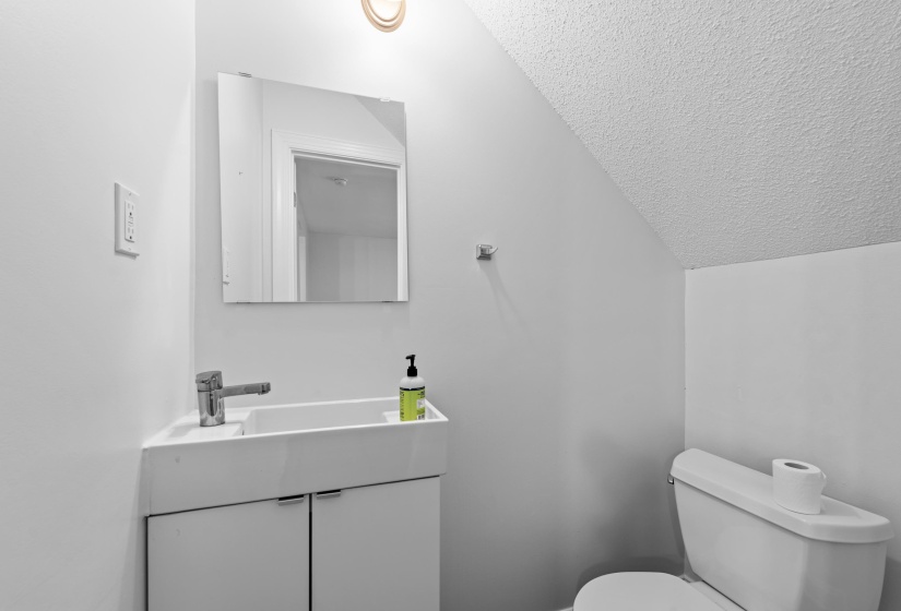 Guests can powder their nose in the updated half bath downstairs.