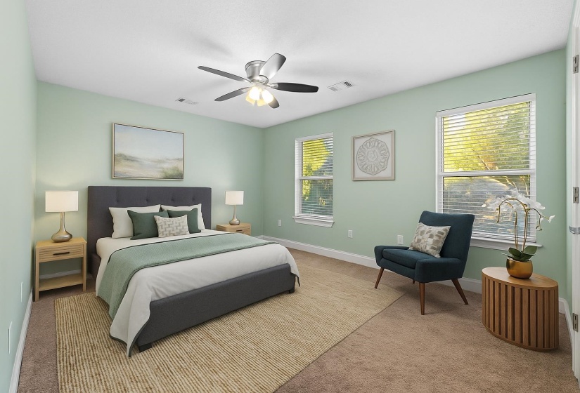 Enjoy brand-new carpet in this inviting primary bedroom, offering a relaxing atmosphere and plenty of space. It is just steps away from the updated bathroom. This photo has been virtually staged.