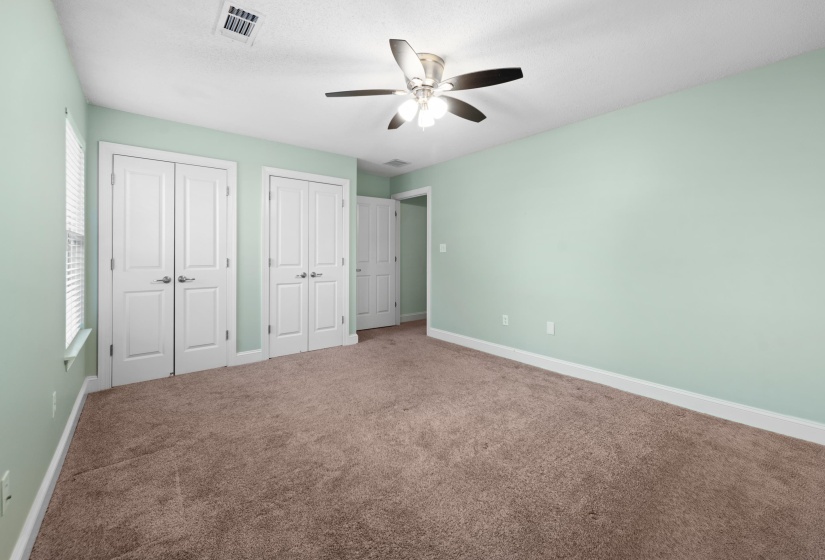 This primary suite comes complete with 2 closets.