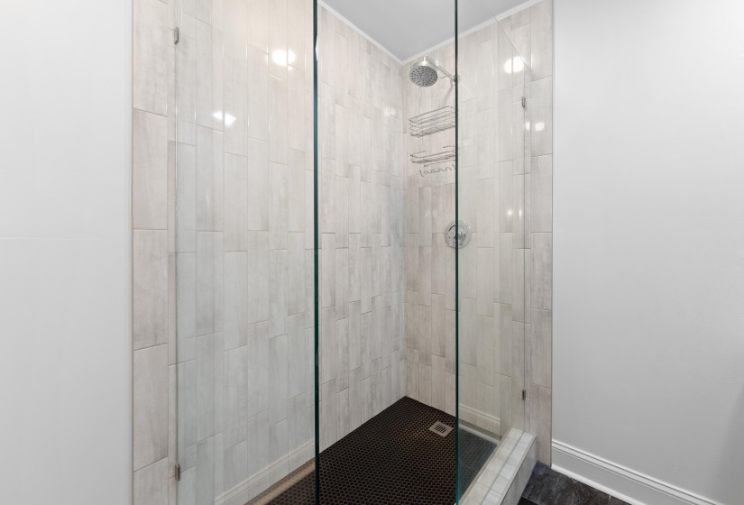 This full bathroom offers a fresh, contemporary feel with new finishes, an upgraded shower, and thoughtful updates throughout. Perfect for daily routines or unwinding after a long day.