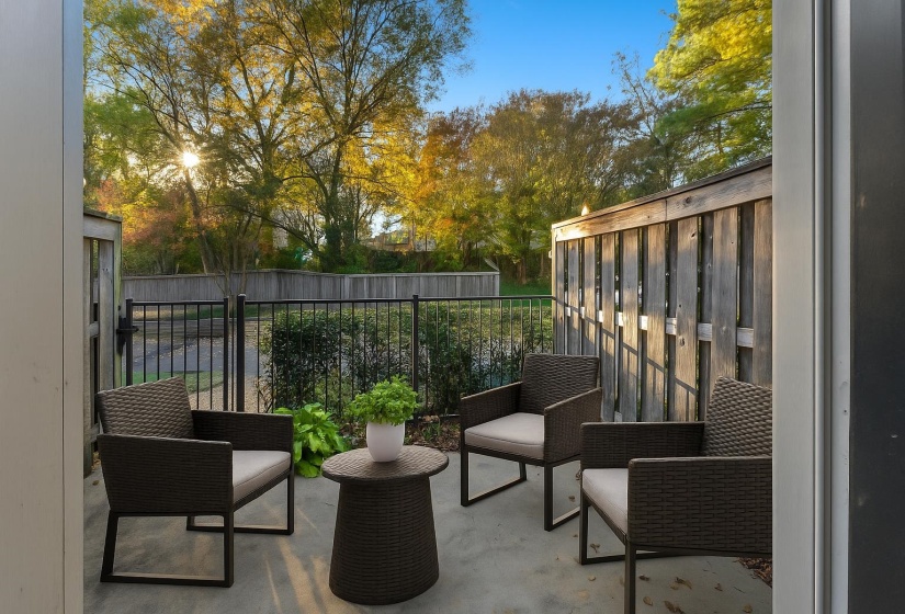 Enjoy a quiet outdoor space perfect for morning coffee, grilling, or unwinding. Fenced for privacy and low-maintenance living. This photo has been virtually staged.