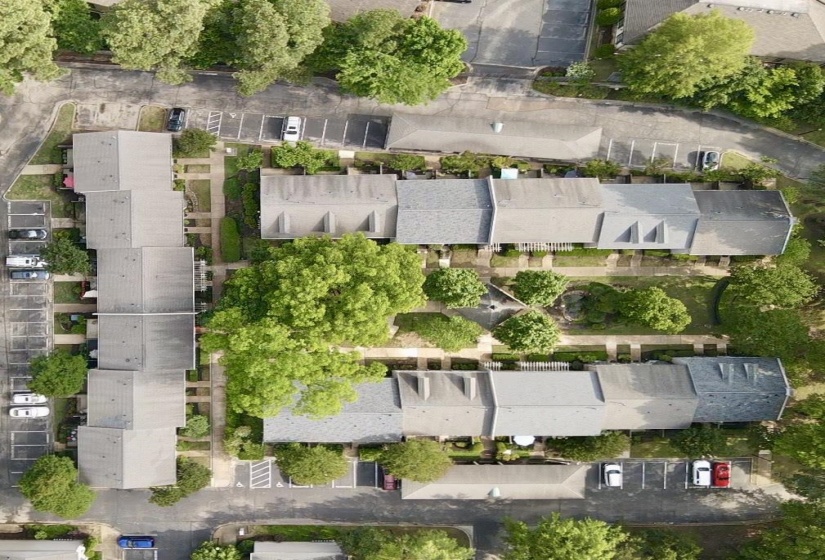 Aerial view emphasizes the condo’s open setting in the community.