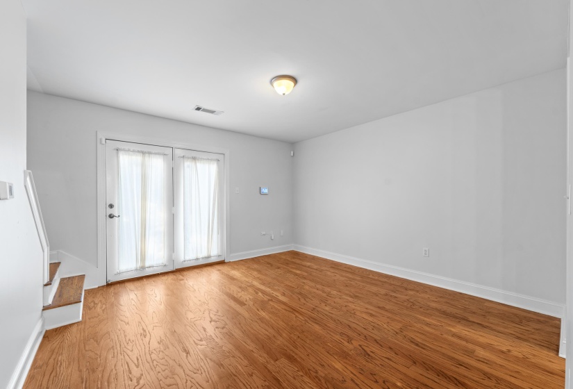 Enjoy meals in a beautifully updated dining space featuring clean lines, neutral tones, and plenty of room for a full dining set. Its airy feel and open flow enhance the home’s move-in-ready appeal. View of the dining room unfurnished.