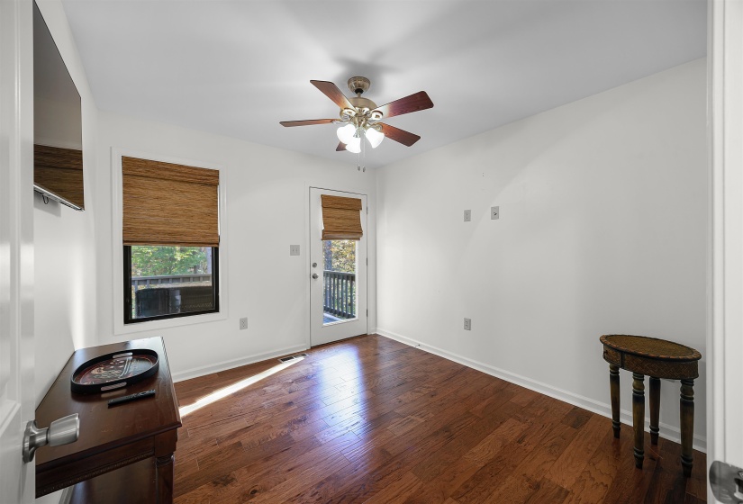 Foyer with dark wood-type flooring and ceiling fan