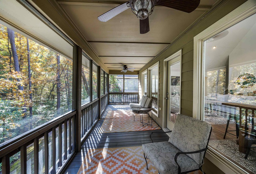 Sunroom / solarium featuring ceiling fan