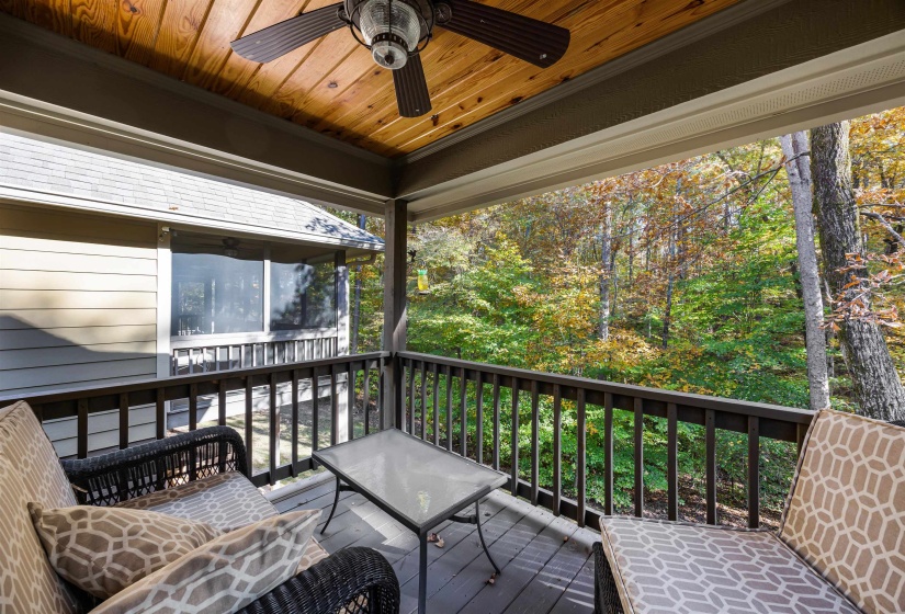 Deck featuring view of wooded area