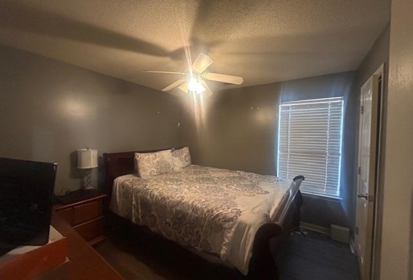Bedroom featuring a textured ceiling and ceiling fan