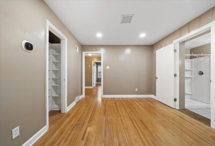 Hall featuring light wood-type flooring and recessed lighting