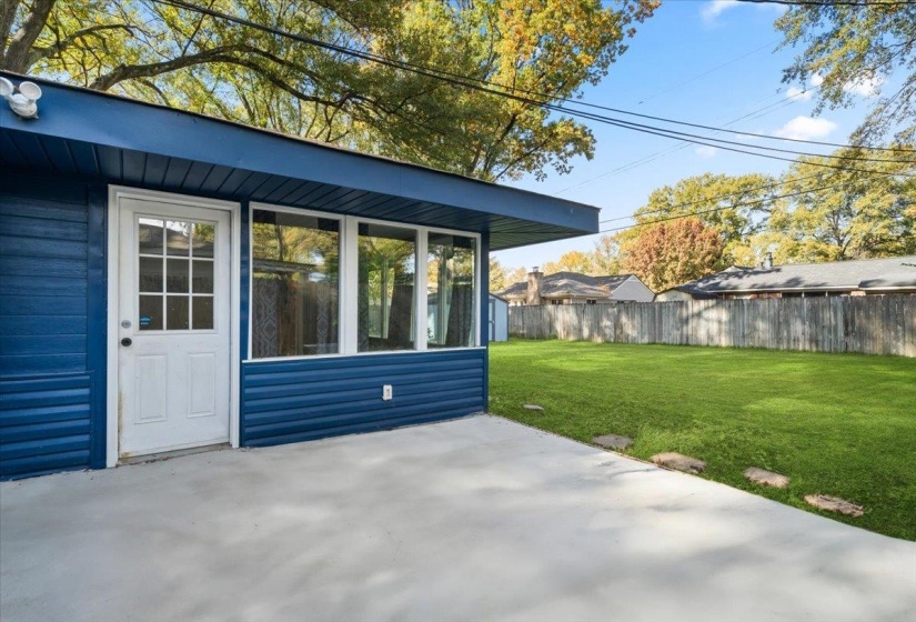 Fenced backyard with a patio area