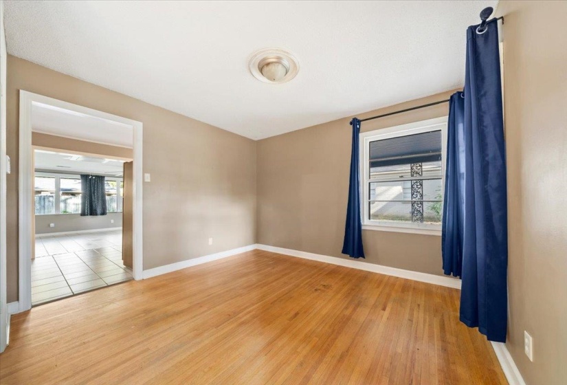 Spare room featuring light wood-style floors and healthy amount of natural light