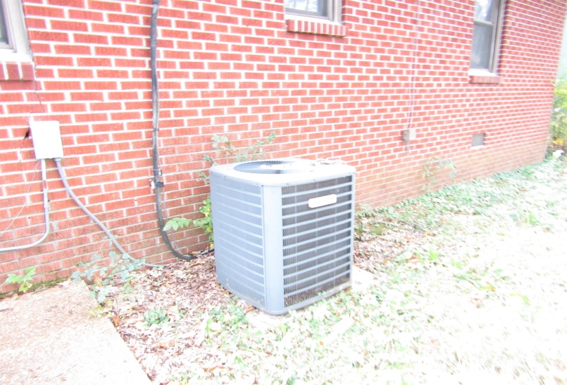 Exterior view of brick siding and crawl space