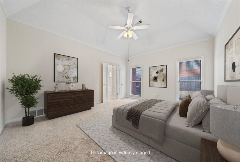 Bedroom featuring crown molding, carpet floors, and ceiling fan