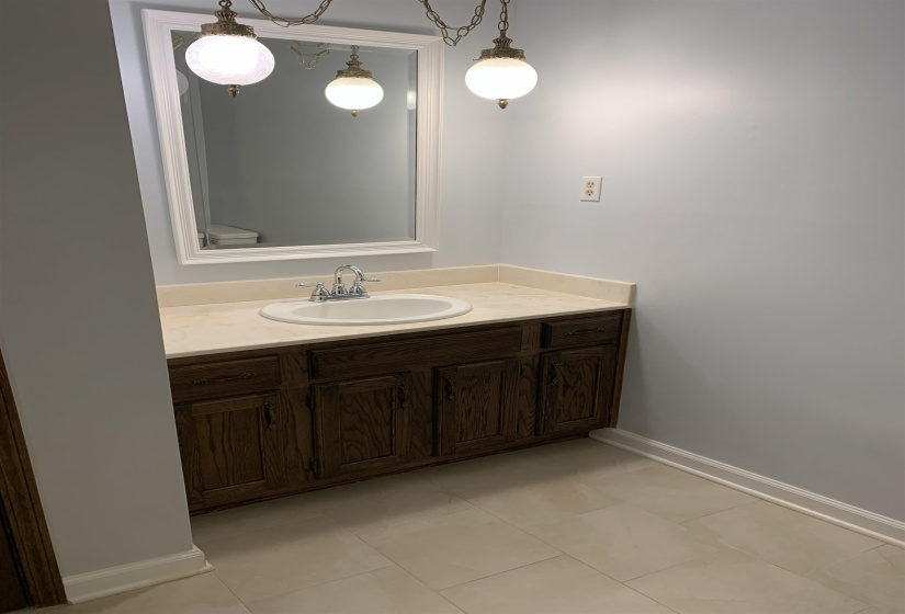 Bathroom featuring vanity and light tile patterned floors