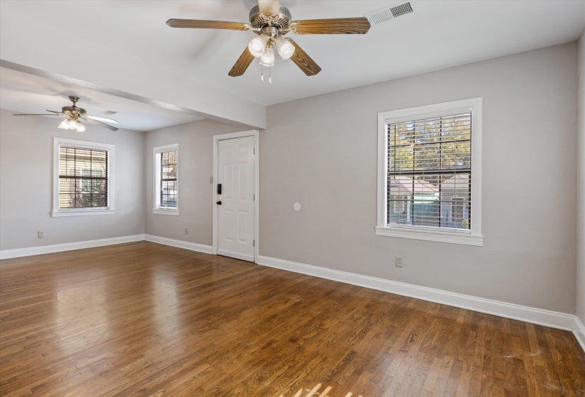 Unfurnished room featuring wood finished floors and a ceiling fan