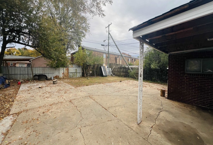 Fenced backyard featuring a patio