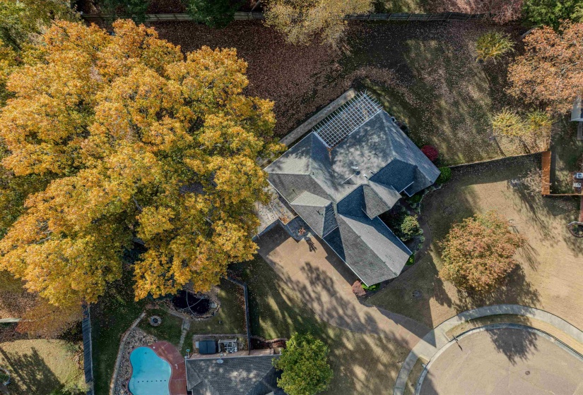 Aerial view of property and surrounding area featuring a pool area