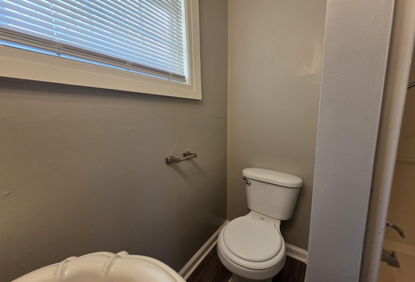 Bathroom featuring toilet and baseboards