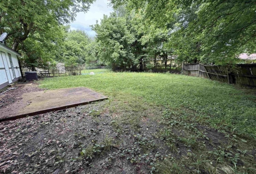 Fenced backyard with a patio area