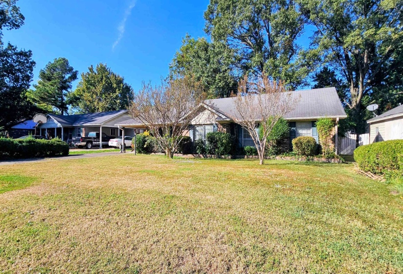 Single story home featuring a front yard