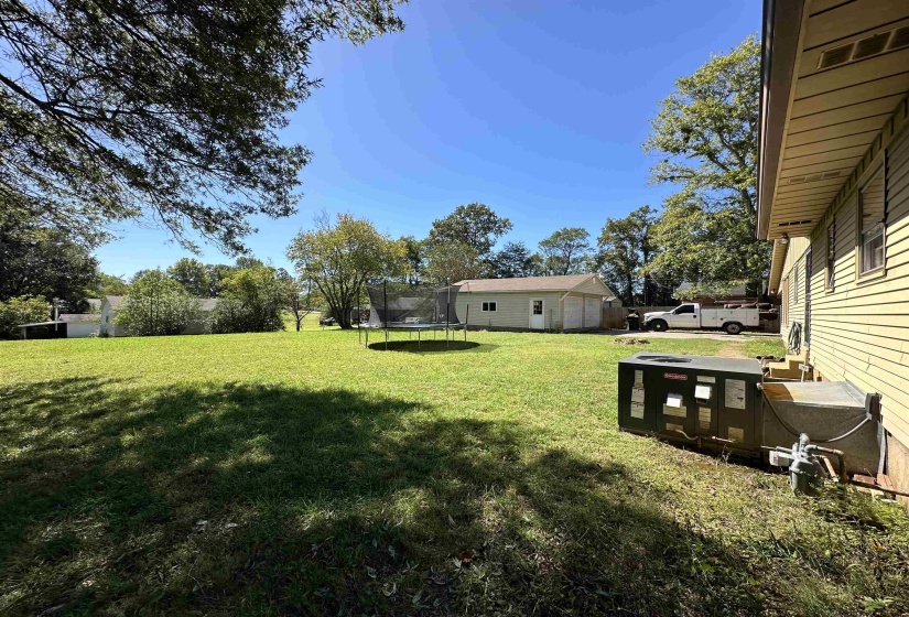 View of yard with a trampoline