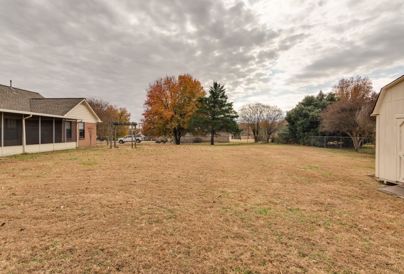 View of yard with a sunroom