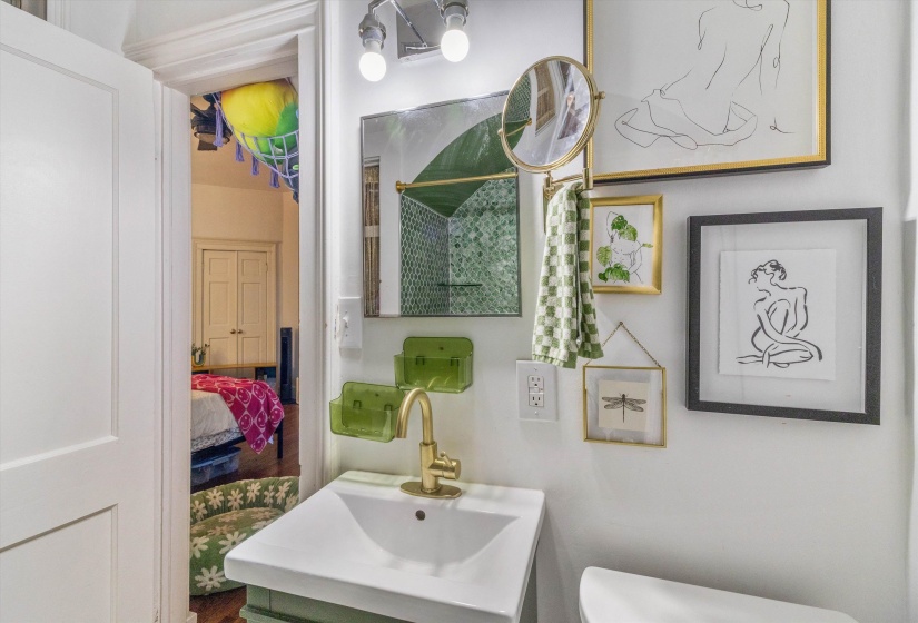 Ensuite bathroom with a shower with shower curtain and vanity