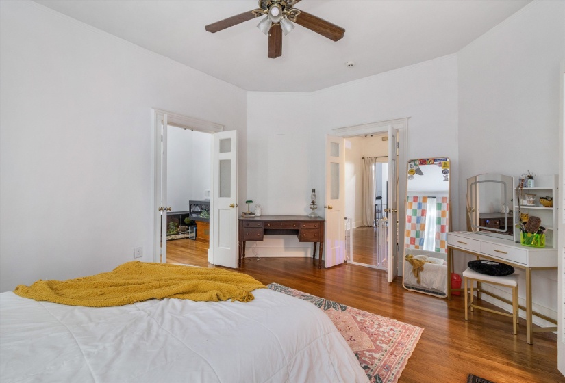 Bedroom featuring wood finished floors and ceiling fan