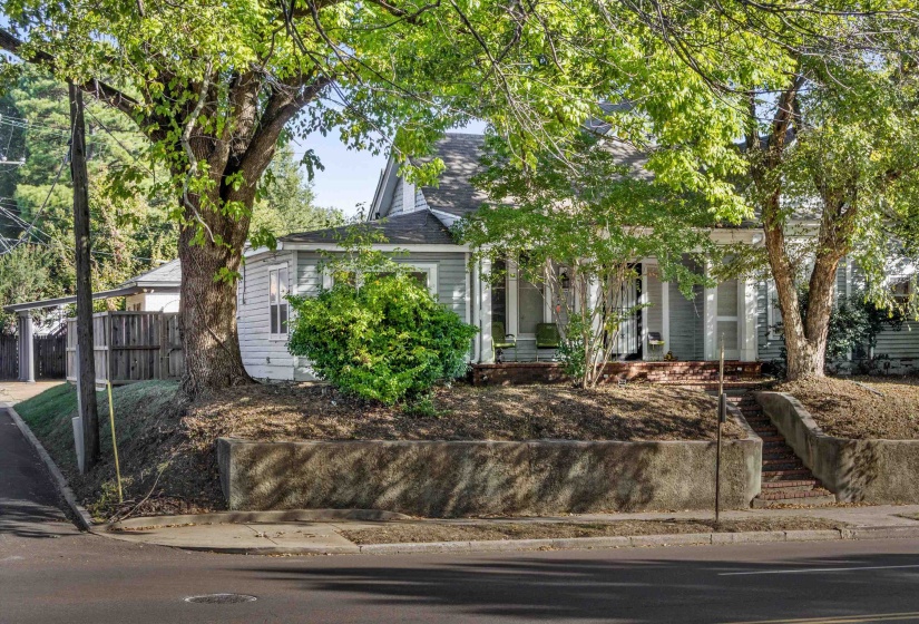 Obstructed view of property with covered porch