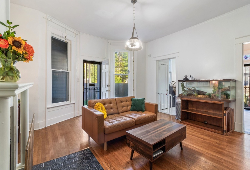 Living room with wood finished floors and baseboards