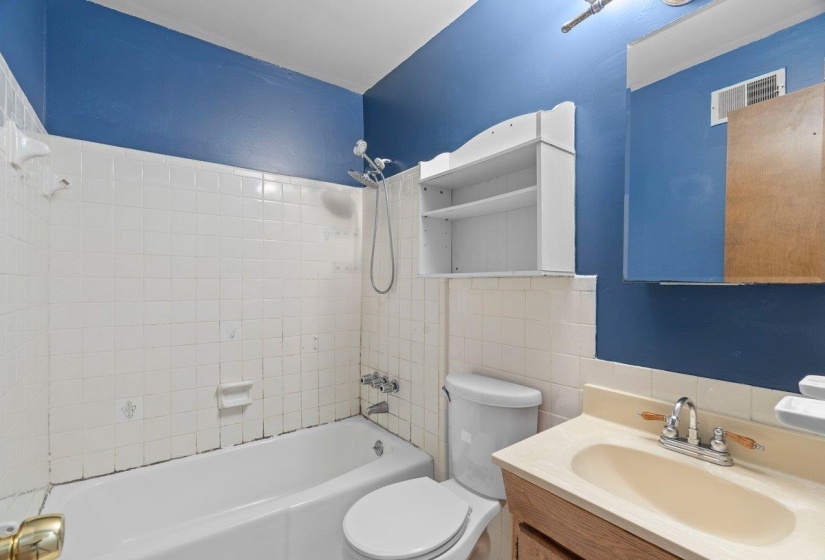 Bathroom featuring shower / washtub combination and vanity