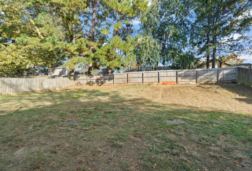 View of fenced backyard