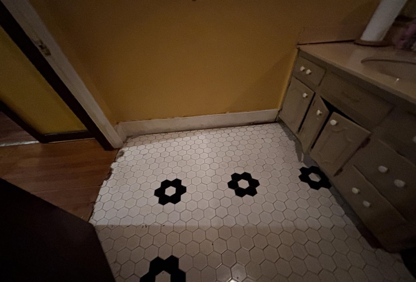 Bathroom with vanity and baseboards