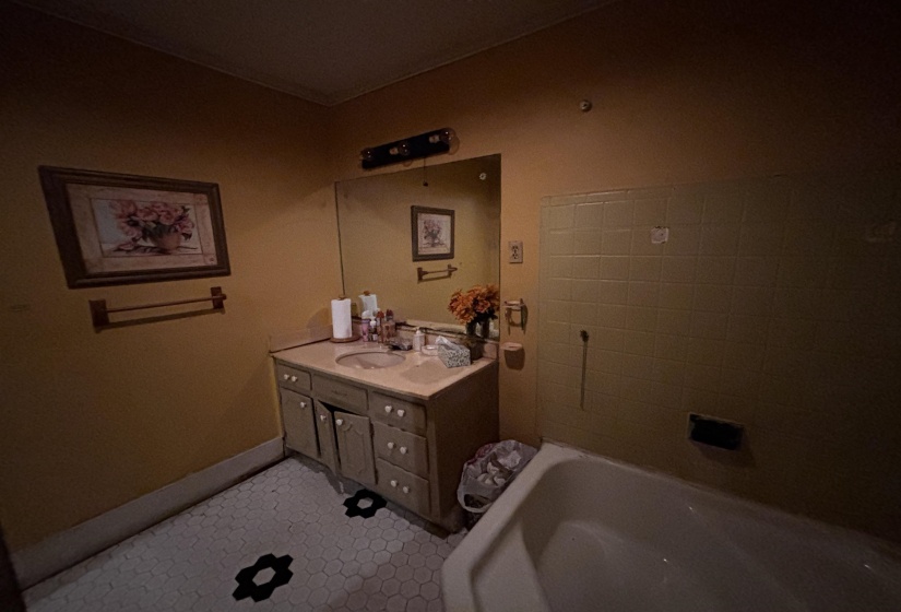 Bathroom featuring a bathtub and vanity
