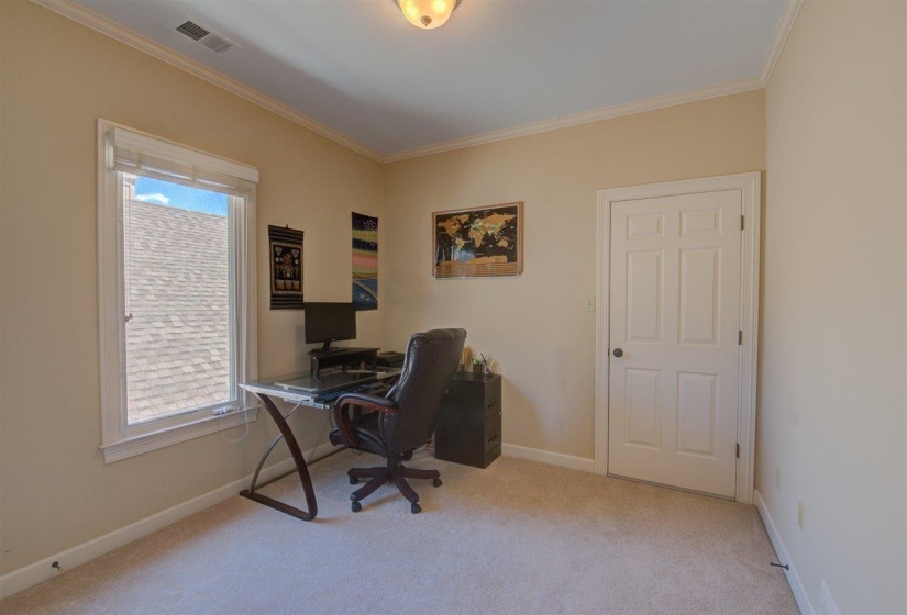 Office area featuring ornamental molding and light colored carpet