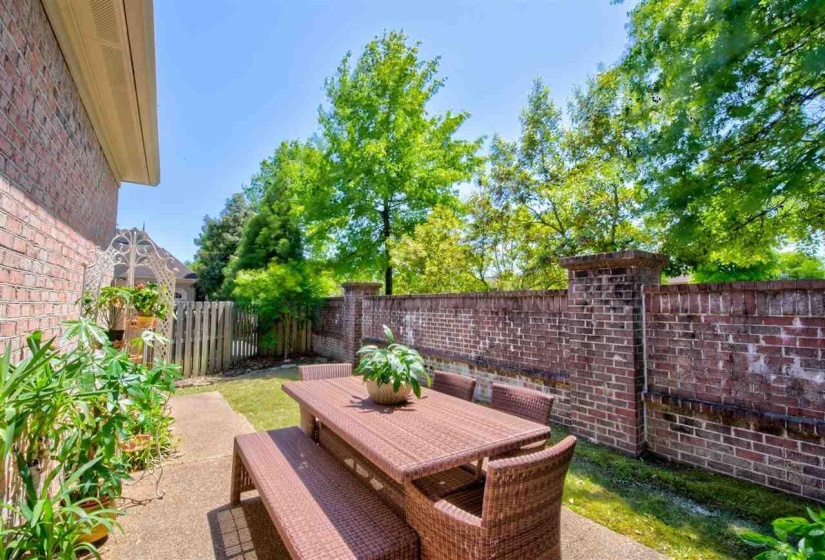 Fenced backyard featuring a patio and outdoor dining space