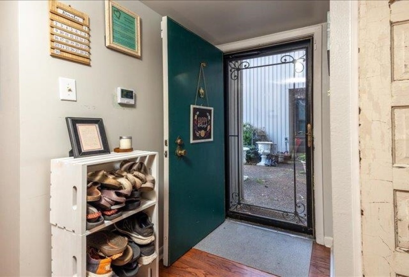 As you can see, the current owners remove their shoes in the entry hall. The storm door is nice so that the front door can be open while you are home.