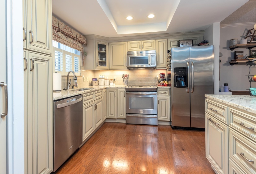 Updated kitchen has all stainless steel appliances. The window offers great light in addition to the recessed lighting.