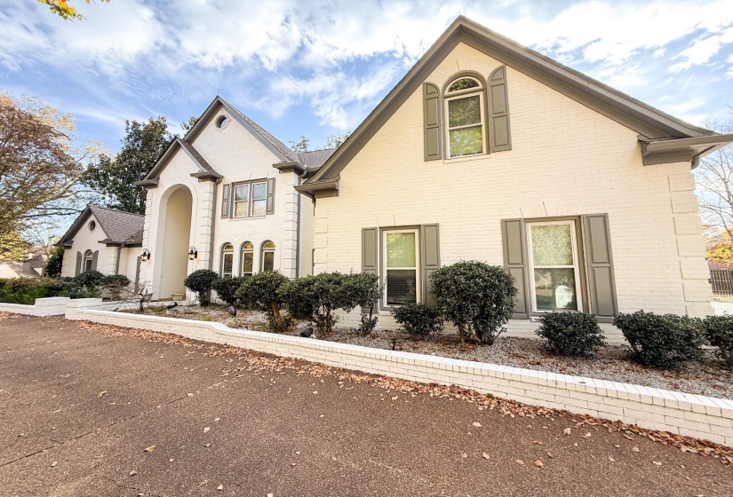 French country style house with brick siding