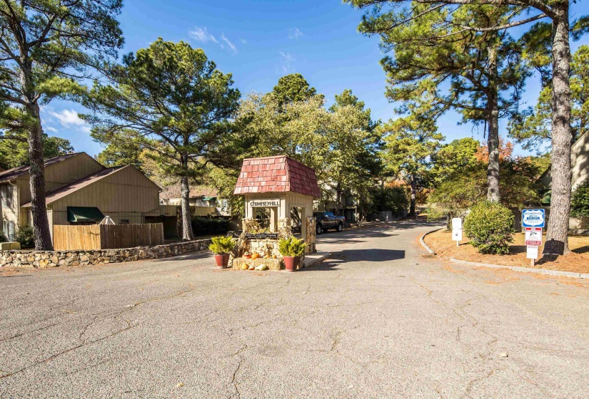 View of asphalt road featuring curbs