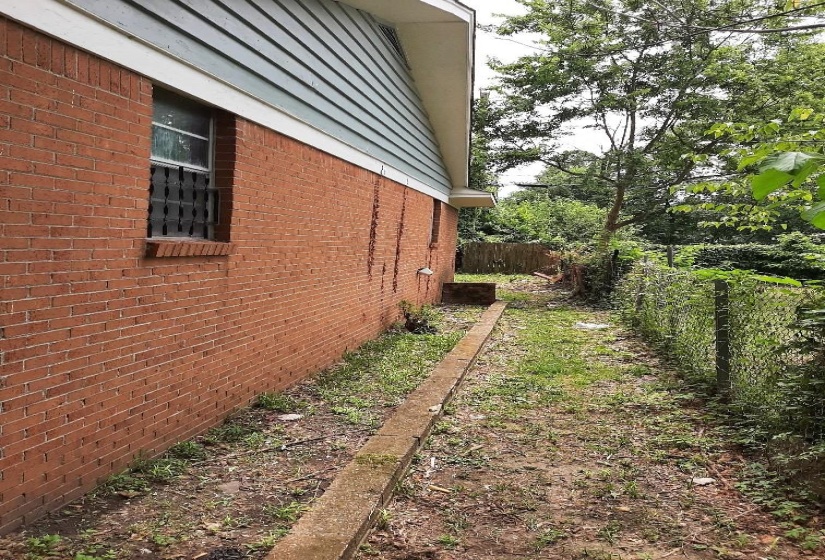 View of side of property with brick siding