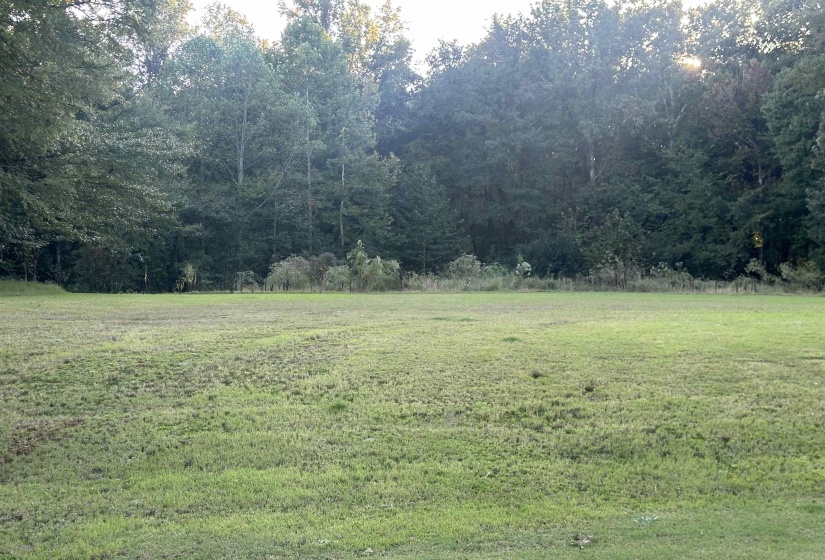 View of grassy yard with a view of countryside