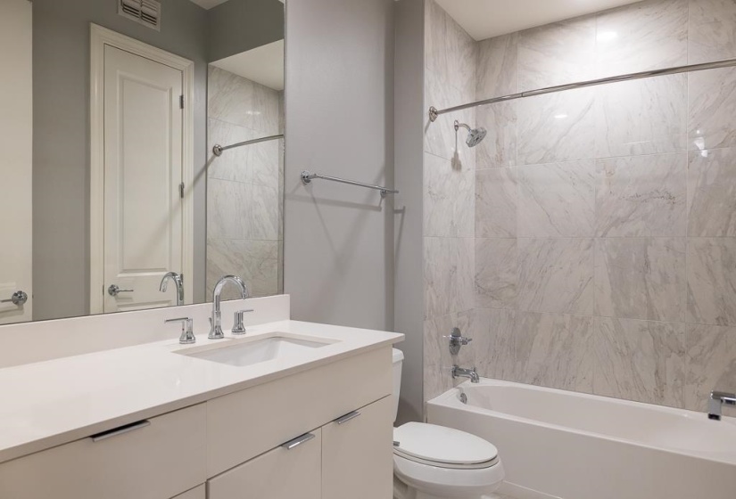 Full bathroom with vanity and bathtub / shower combination