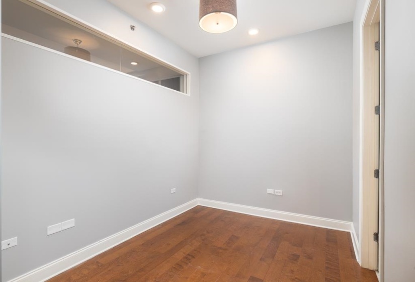Unfurnished room with dark wood finished floors and recessed lighting