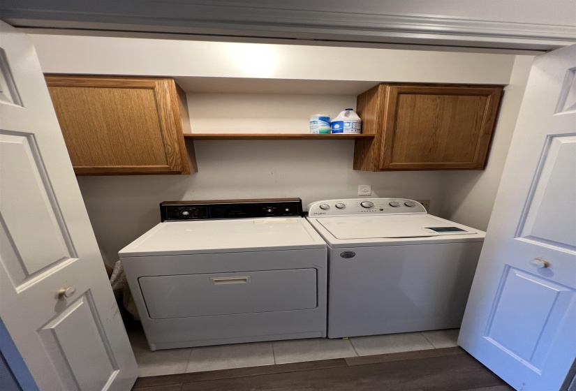 Laundry area with washing machine and clothes dryer and cabinet space