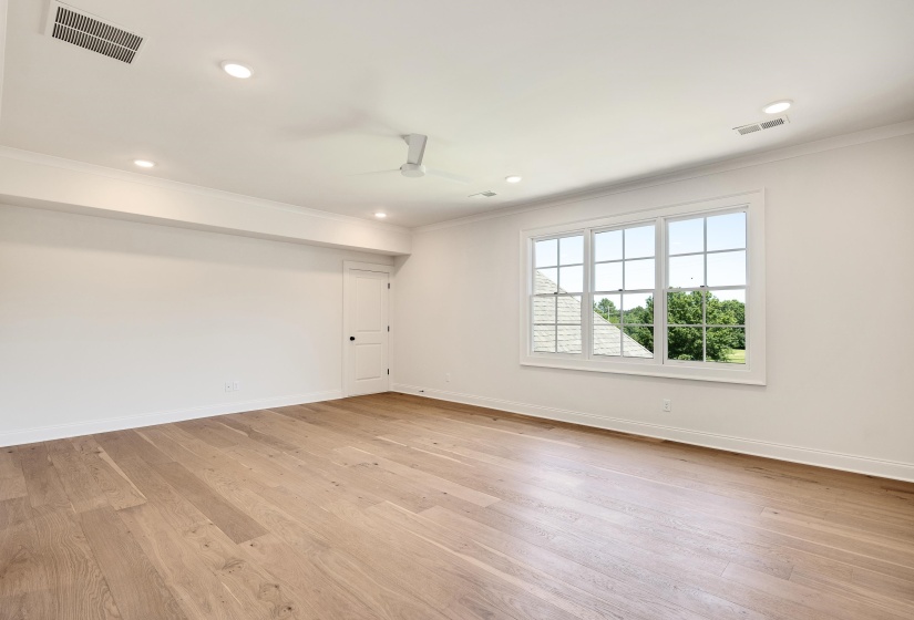 Empty room with ornamental molding, baseboards, light wood-style flooring, ceiling fan, and recessed lighting